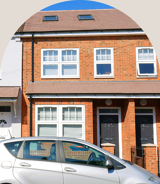 Flat conversion main Flat conversion of a single dwelling into separate units, featuring a red-brick terraced house with individual entrances and dormer loft windows.