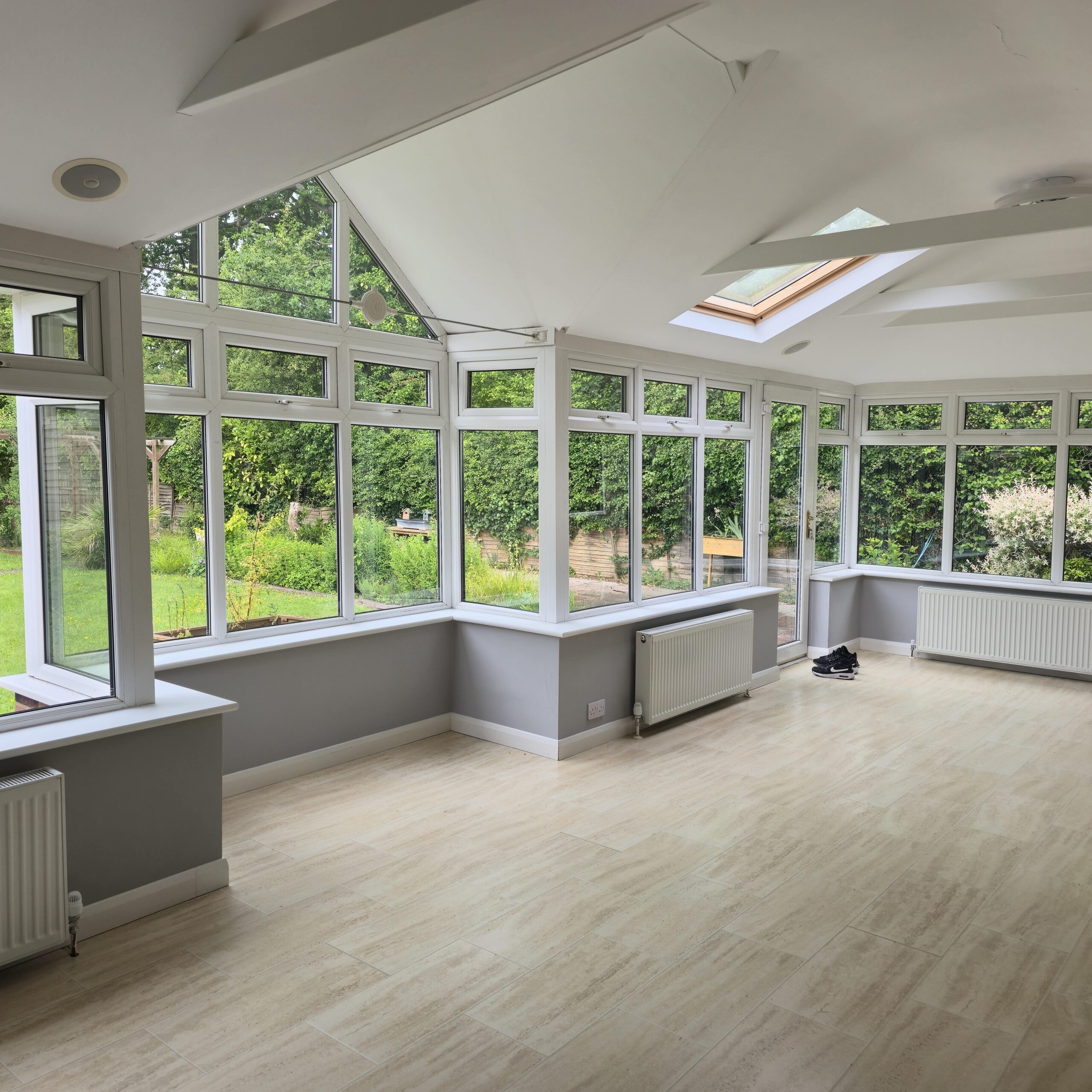 Conservatory building regulations Modern conservatory with building regulations compliant glazing and integrated heating system showing radiators installed